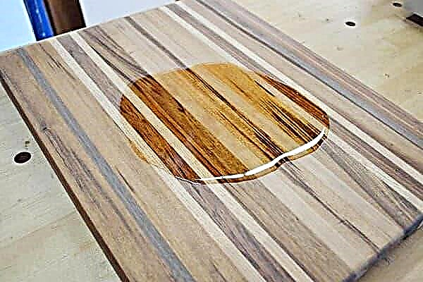 What is wood chopping board treated before use?